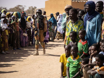 A Burkina Faso soldier patrols a district welcoming Internally Displaced People (IDP) from northern Burkina Faso in Dori, on February 3, 2020.