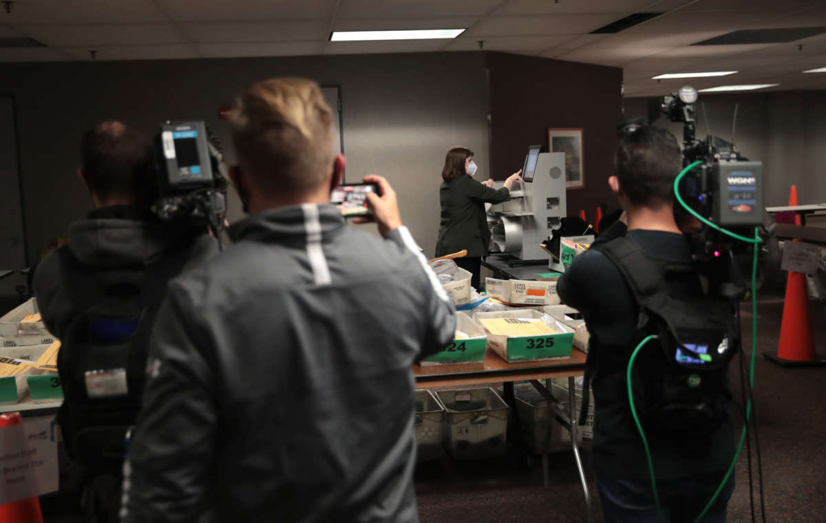 Claire Woodall-Vogg, executive director of the Milwaukee election commission, collects the count from absentee ballots from a voting machine on November 4, 2020, in Milwaukee, Wisconsin.