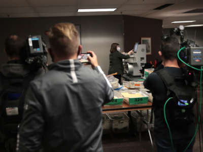 Claire Woodall-Vogg, executive director of the Milwaukee election commission, collects the count from absentee ballots from a voting machine on November 4, 2020, in Milwaukee, Wisconsin.