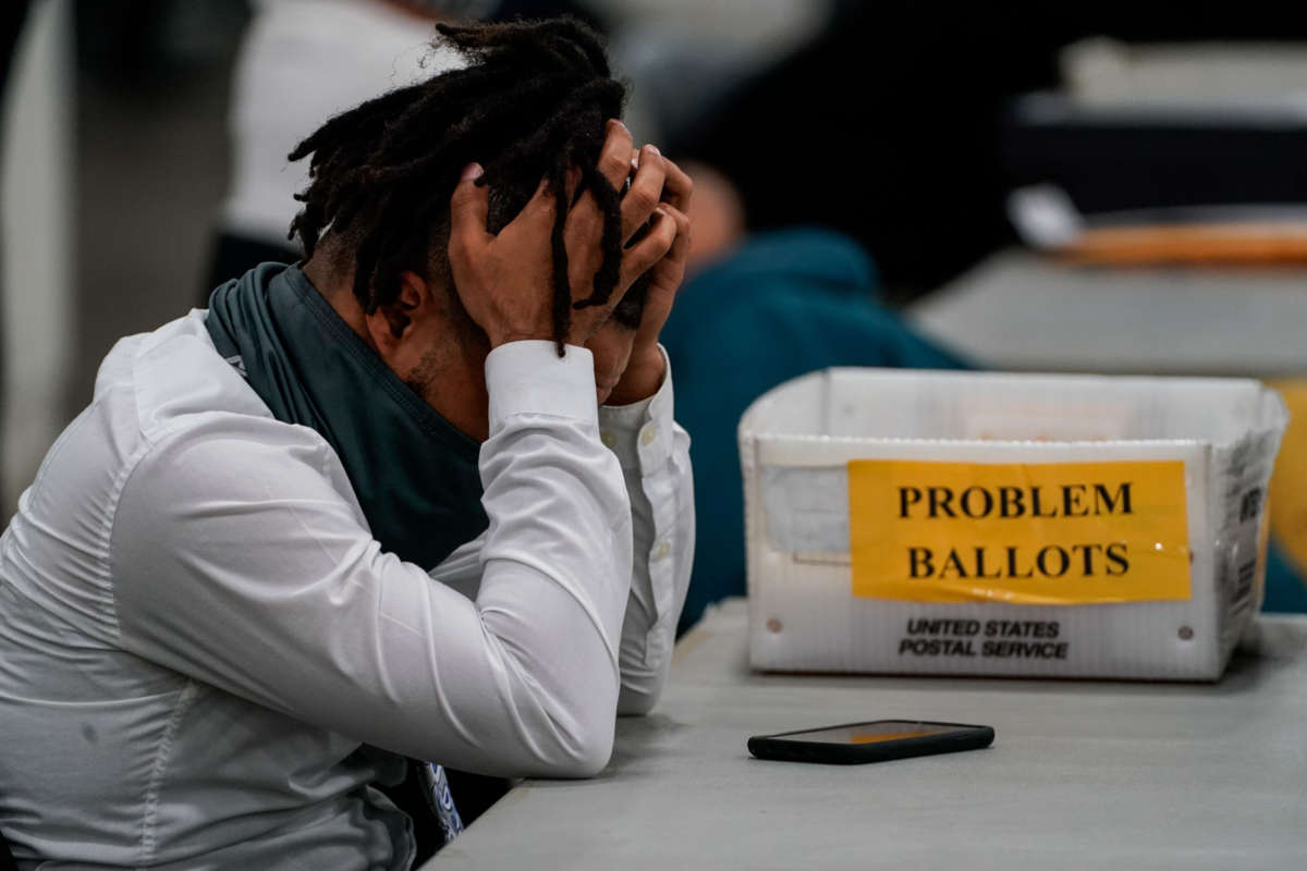 A Board of elections worker takes a quick break after processing ballots at the Detroit Department of Elections Central Counting Board of Voting absentee ballot counting center at TCF Center on November 4, 2020, in Detroit, Michigan.