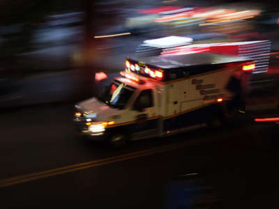 An ambulance drives through Borough Park on September 28, 2020, in New York City.