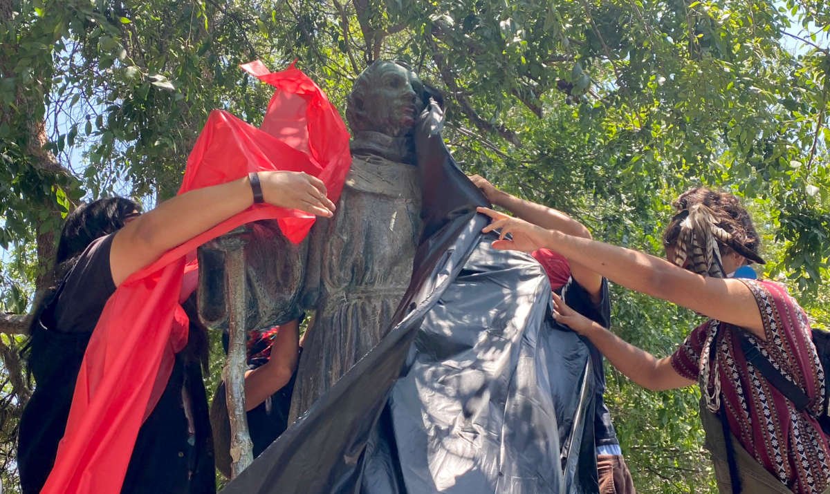 LaRazaUnida cover the Fray Junípero Serra Statue in protest at the Brand Park Memory Garden across from the San Fernando Mission in San Fernando on June 28, 2020.