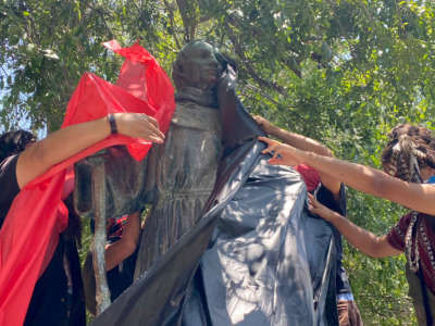 LaRazaUnida cover the Fray Junípero Serra Statue in protest at the Brand Park Memory Garden across from the San Fernando Mission in San Fernando on June 28, 2020.