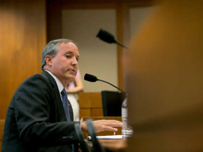 Texas Attorney General Ken Paxton testifies in front of the Senate Committee on Health and Human Services on July 29, 2015, just a few days before a grand jury indicted him on three felonies.