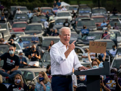 Joe Biden speaks during a drive-in campaign rally in the parking lot of Cellairis Ampitheatre on October 27, 2020, in Atlanta, Georgia.