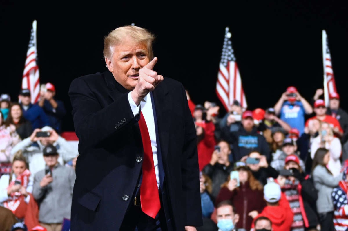 President Trump gestures after speaking during a rally to support Republican Senate candidates at Valdosta Regional Airport in Valdosta, Georgia, on December 5, 2020.