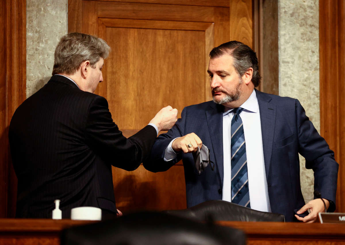 Sen. John Kennedy and Sen. Ted Cruz share an elbow bump greeting at a Senate Judiciary Committee hearing on Capitol Hill in Washington, D.C., on November 17, 2020.