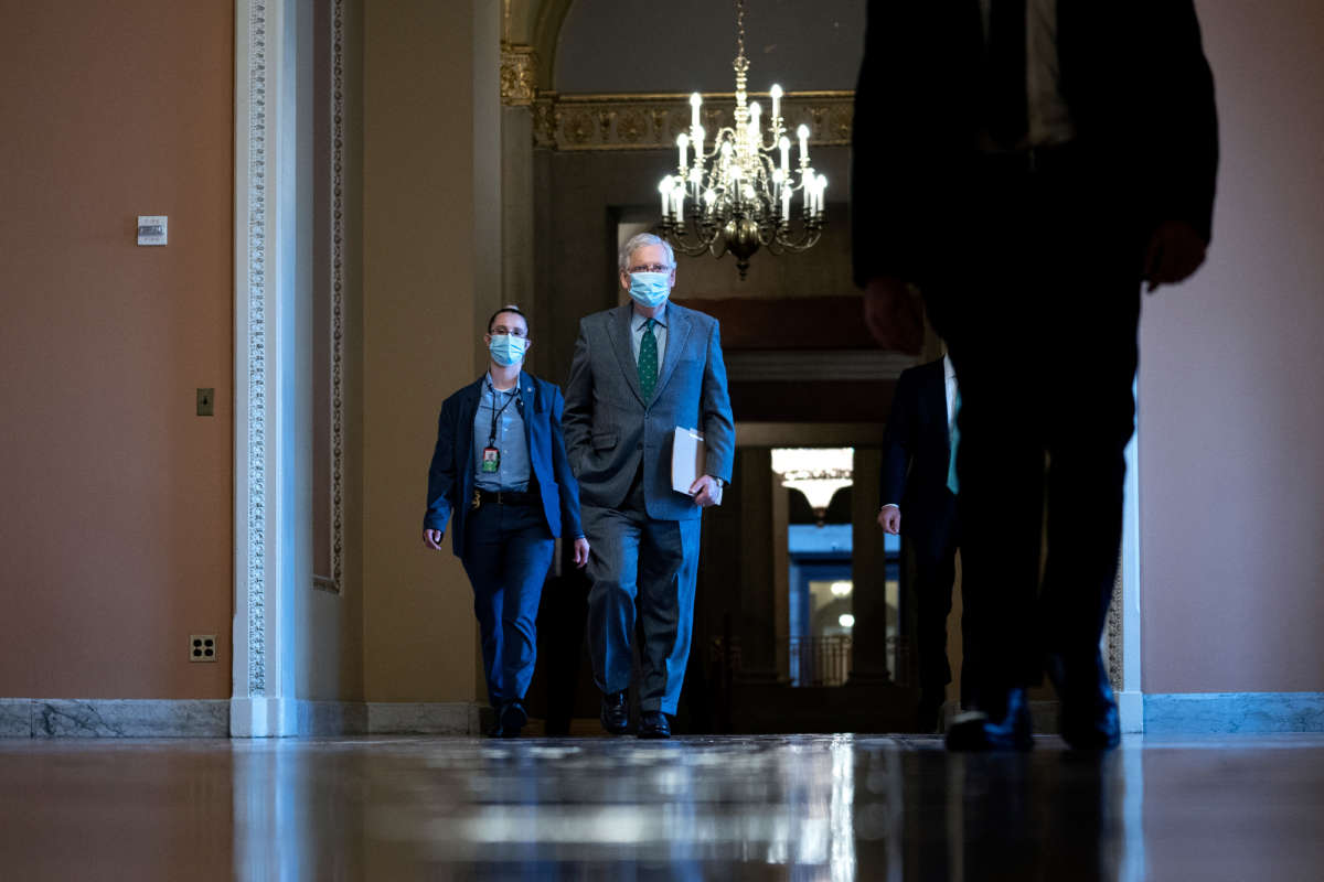 Senate Majority Leader Mitch McConnell wears a protective mask as he walks to the Senate floor on October 21, 2020, in Washington, D.C.