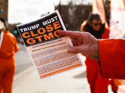 Activists from the Guantanamo Justice Campaign, a group calling for the U.S. to close its Guantanamo Bay prison camp, and for the British government to lobby the United States to this end, demonstrate in orange detainee jumpsuits outside the Houses of Parliament in London.