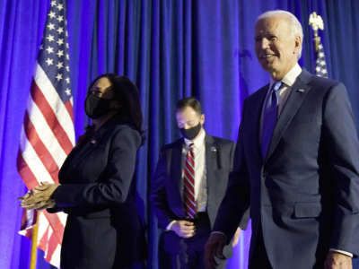 Democratic presidential nominee Joe Biden and vice presidential nominee Sen. Kamala Harris leave the stage after addressing the nation at the Chase Center November 6, 2020, in Wilmington, Delaware.