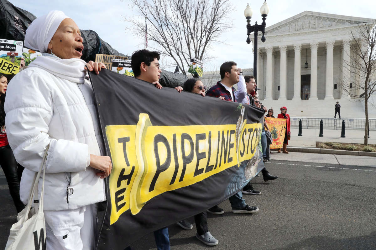 Climate activist groups protest the Atlantic Coast Pipeline in front of the Supreme Court
