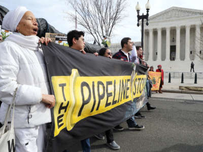 Climate activist groups protest the Atlantic Coast Pipeline in front of the Supreme Court