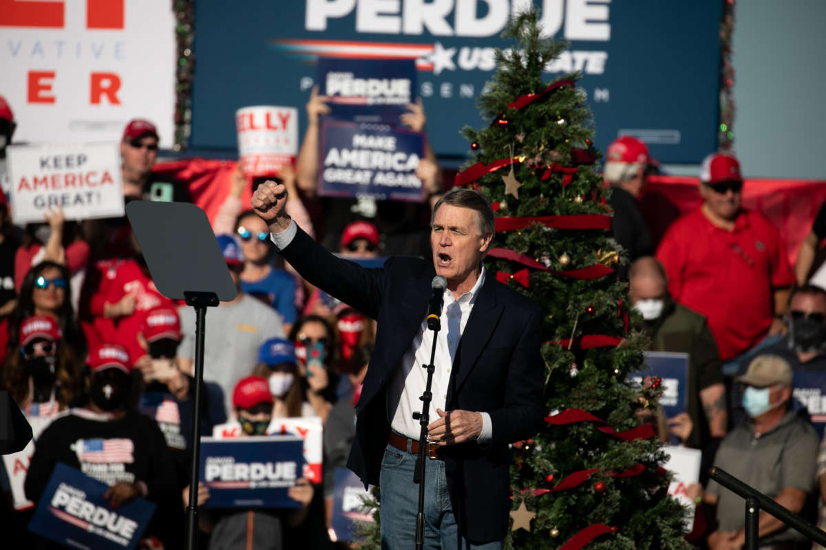 Sen. David Purdue speaks to the crowd during a rally with Vice President Mike Pence in support of himself and Sen. Kelly Loeffler on December 10, 2020, in Augusta, Georgia.