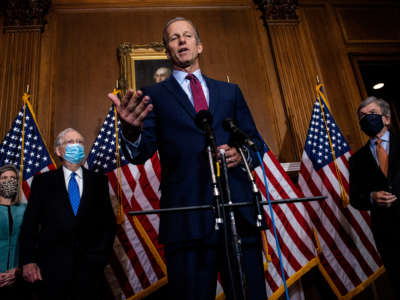 Sen. John Thune talks to reporters following the weekly Republican Senate conference meeting in the Mansfield Room at the U.S. Capitol on December 1, 2020, in Washington, D.C.