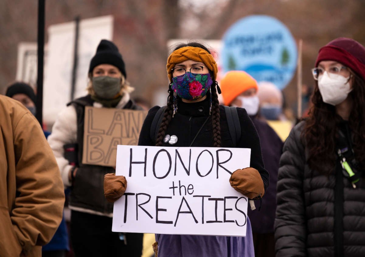 People protest against the Enbridge Energy Line 3 oil pipeline project outside the Governor's Mansion on November 14, 2020, in St Paul, Minnesota.