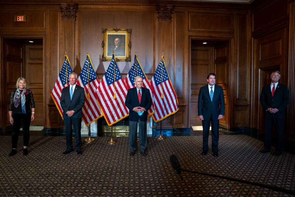 Mitch Mcconnell and other associated republican senators stand for a photo op