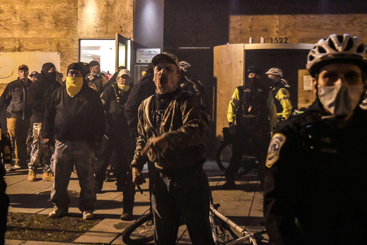 Members of the Proud Boys yell in front of a hotel during a protest on December 12, 2020, in Washington, D.C.