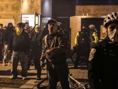 Members of the Proud Boys yell in front of a hotel during a protest on December 12, 2020, in Washington, D.C.