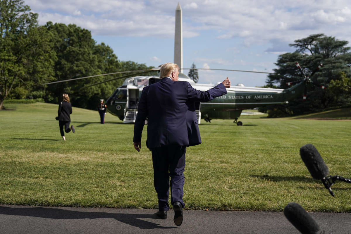 President Donald Trump give a thumbs up after speaking to the media as he departs for Walter Reed National Military Medical Center from the White House on July 11, 2020, in Washington, D.C.
