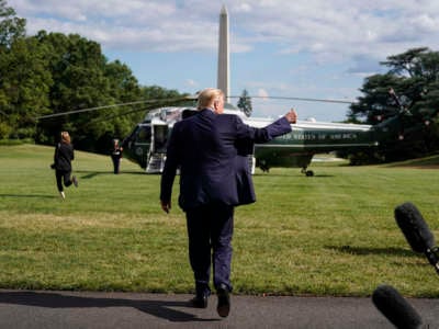 President Donald Trump give a thumbs up after speaking to the media as he departs for Walter Reed National Military Medical Center from the White House on July 11, 2020, in Washington, D.C.