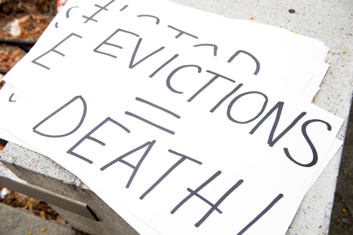 Signs are seen during a protest to cancel rent and avoid evictions in front of the court house amid Coronavirus pandemic on August 21, 2020, in Los Angeles, California.