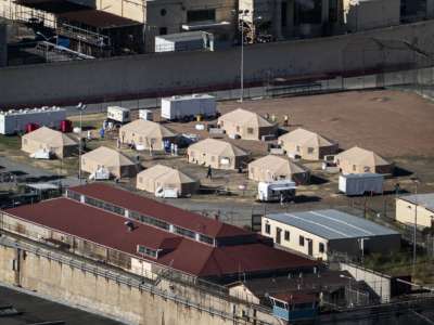 An aerial shot of tents in a concentration camp