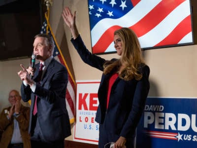 Sen David Perdue and Sen Kelly Loeffler speak at a campaign event to supporters at a restaurant on November 13, 2020, in Cumming, Georgia.