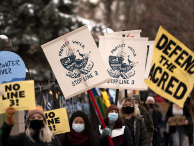 People protest against the Enbridge Energy Line 3 oil pipeline project outside the Governor's Mansion on November 14, 2020, in St Paul, Minnesota.