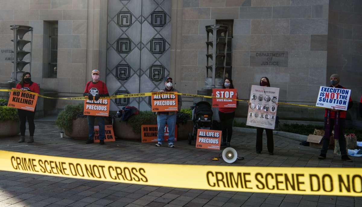 Demonstrators protest federal executions of death row inmates, in front of the U.S. Justice Department in Washington, D.C., on December 10, 2020.