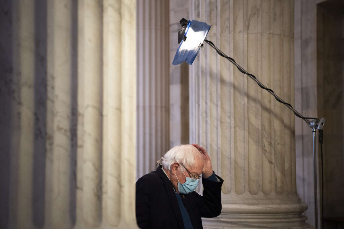 Sen. Bernie Sanders prepares to do an interview with MSNBC in the Russell Rotunda in Washington, D.C., on Wednesday, December 16, 2020.