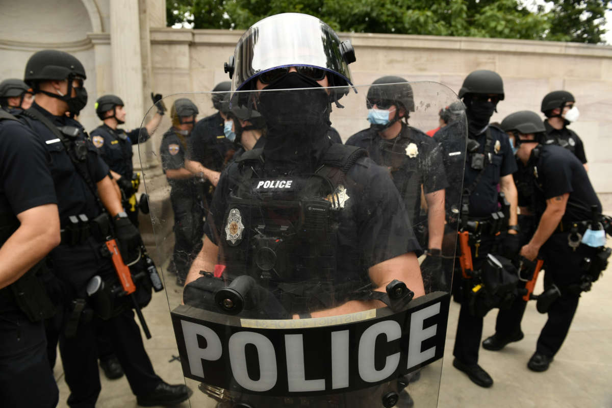 Denver Police officers watch over the crowd at Civic Center Park on July 19, 2020, in Denver, Colorado.