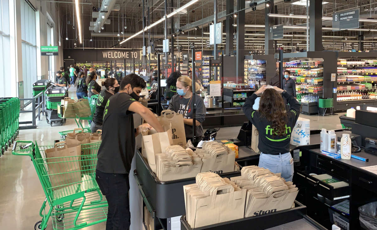 An employees bags groceries at a newly opened Amazon Fresh store on Jamboree Road in Irvine, California, on Thursday, October 22, 2020.