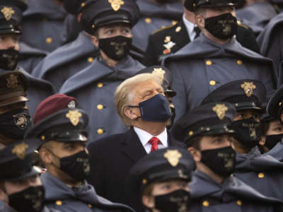 President Donald Trump sits with the United States Military Academy Corps of Cadets during the game between the Army Black Knights and the Navy Midshipmen at Michie Stadium on December 12, 2020, in West Point, New York.