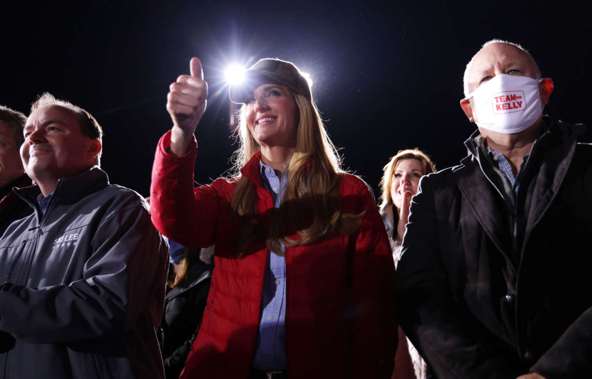 Sen. Kelly Loeffler gives a thumbs-up at a campaign rally at Dalton Regional Airport on January 4, 2021, in Dalton, Georgia.