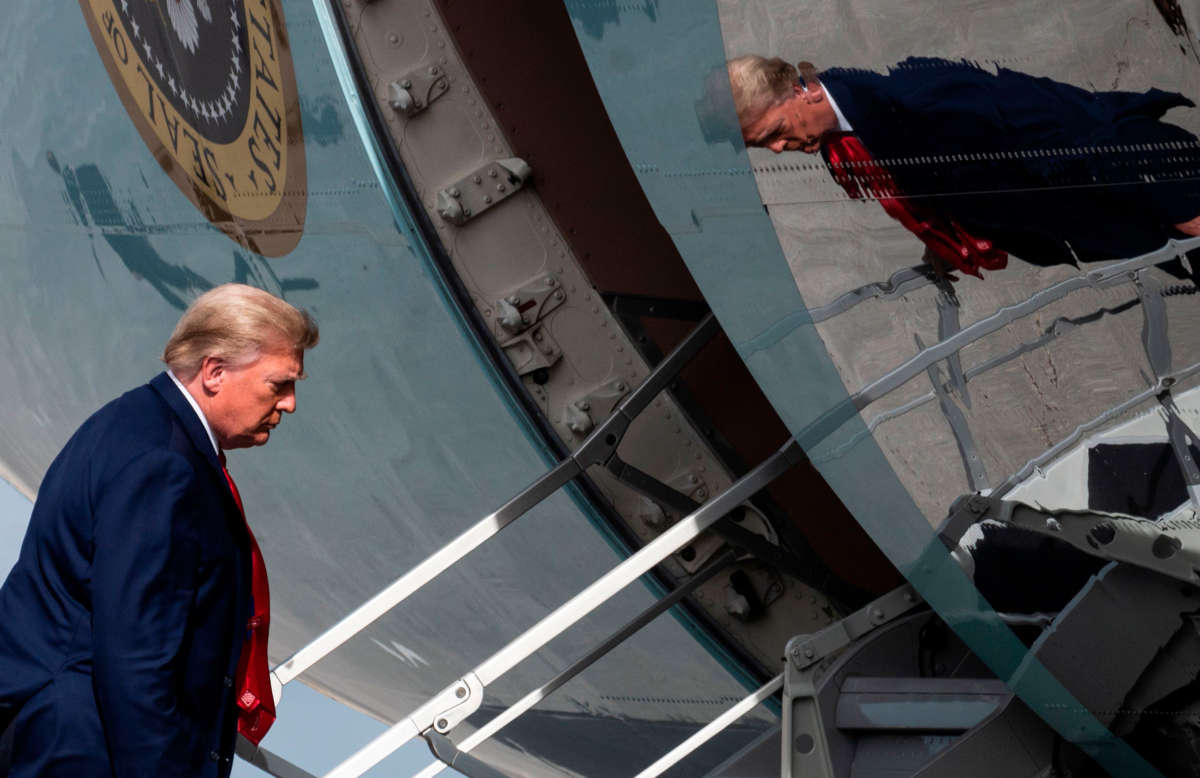President Trump boards Air Force One while departing from Palm Beach International Airport in West Palm Beach, Florida, on December 31, 2020.