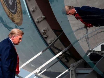 President Trump boards Air Force One while departing from Palm Beach International Airport in West Palm Beach, Florida, on December 31, 2020.