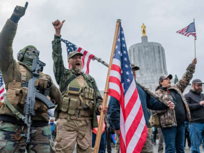 Armed supporters of President Trump chant during a rally on January 6, 2021, in Salem, Oregon.