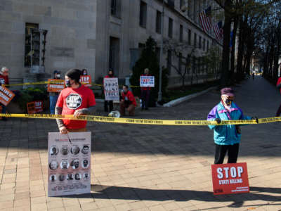 Demonstrators protest federal executions of death row inmates in front of the U.S. Justice Department in Washington, D.C., on December 10, 2020.