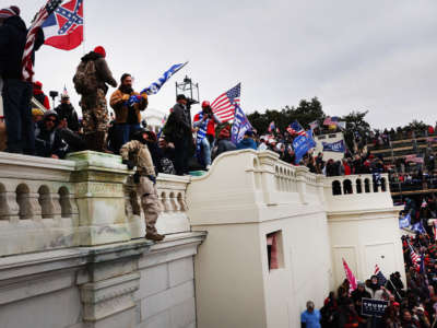 Trump loyalists storm the U.S. Capitol building following a rally on January 6, 2021, in Washington, D.C.