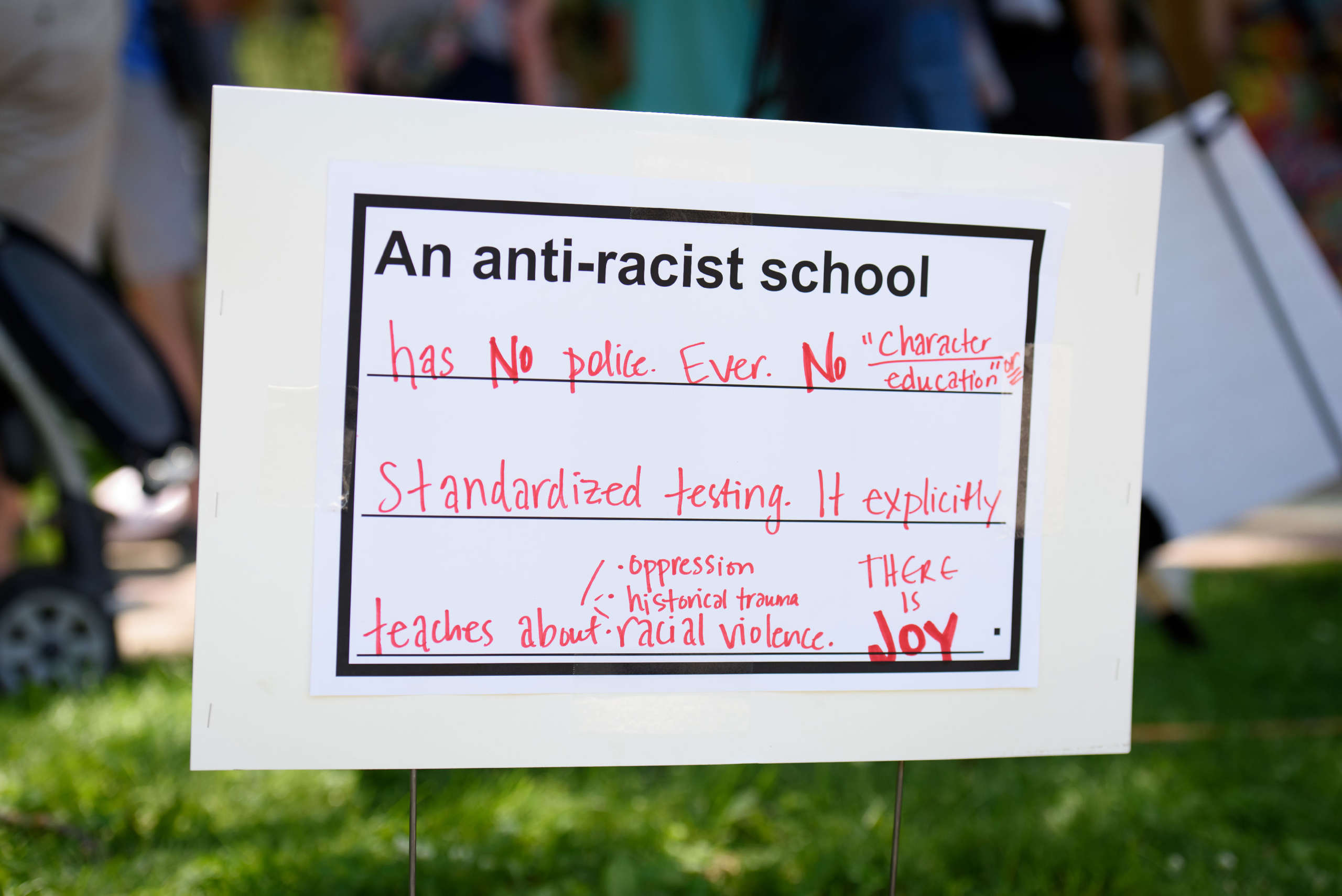 A parent’s vision for an antiracist school is posted in front of an elementary school during a Day of Solidarity action in Madison, Wisconsin.