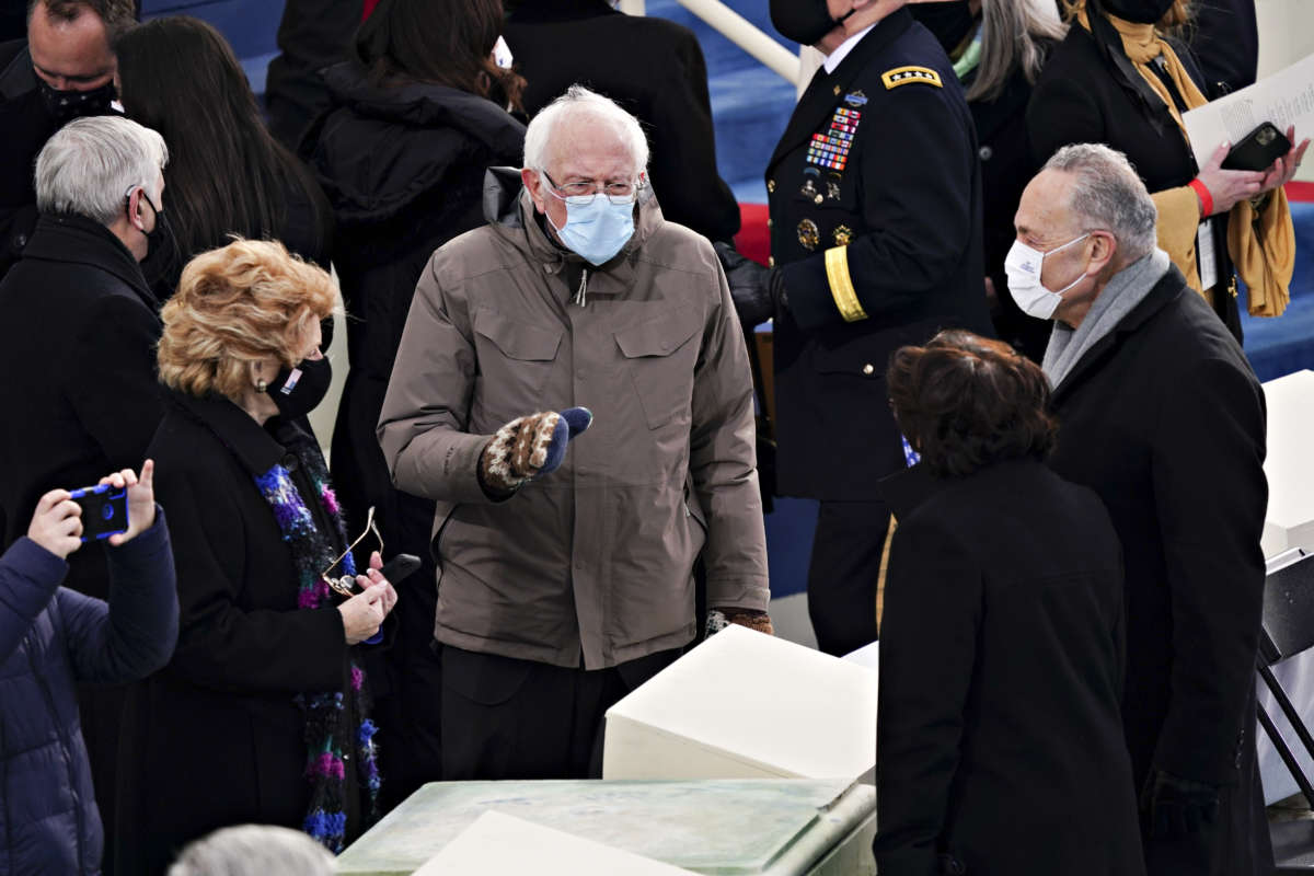 Bernie Sanders and his mittens tell Charles Schumer something