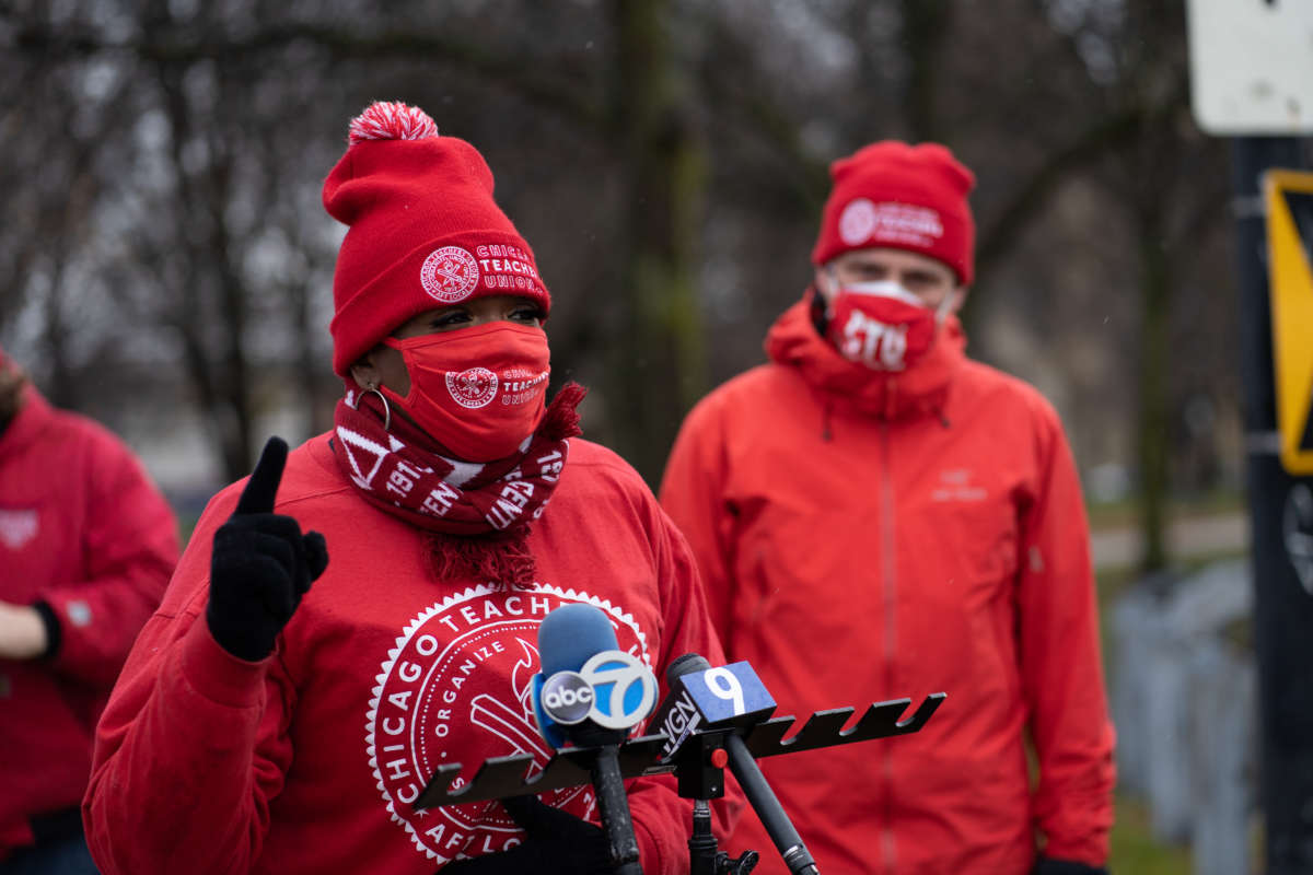 Former teacher Tara Stamps speaks ahead of a car caravan where teachers and supporters gathered to demand a safe and equitable return to in-person learning during the COVID-19 pandemic in Chicago, Illinois, on December 12, 2020.