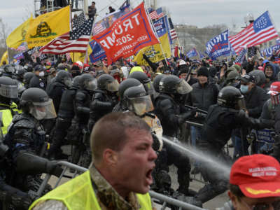 Trump loyalists clash with police and security forces as people try to storm the U.S. Capitol in Washington D.C., on January 6, 2021.