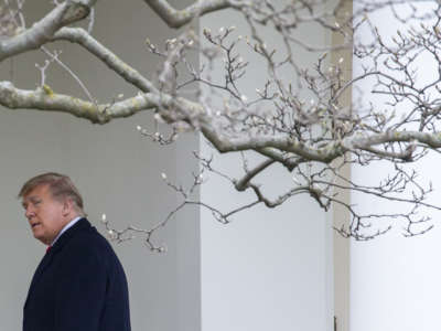 President Donald Trump walks to the Oval Office while arriving back at the White House on December 31, 2020, in Washington, D.C.