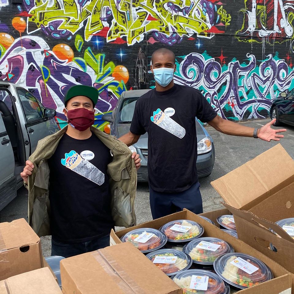 Mikey Disko and Malcolm Jefferson spread mutual aid love and get pumped to load up volunteers with hot meals, provided by World Central Kitchen, for socially distant distributions to unhoused folks in Oakland, California.