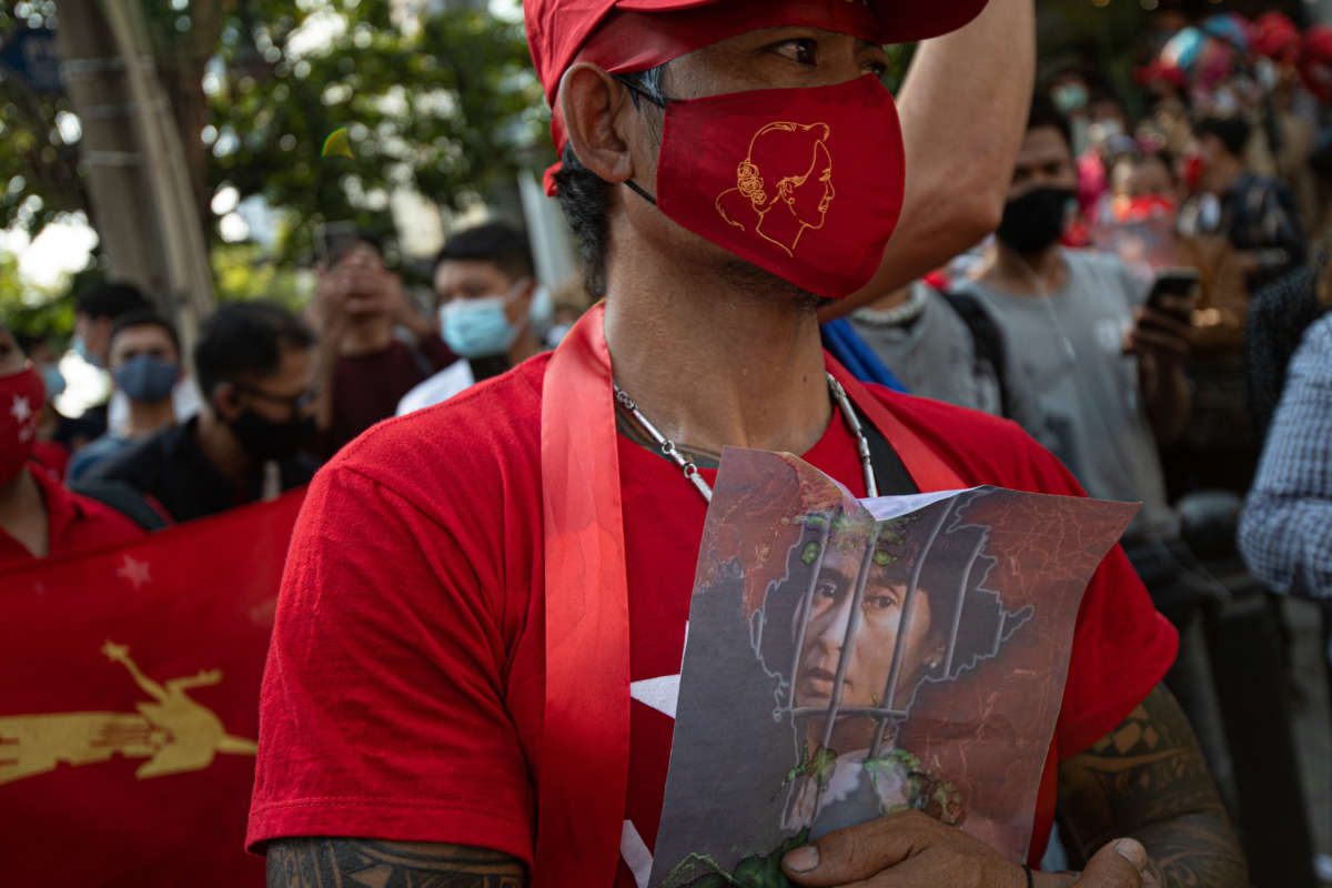 NLD supporter holds up a picture of leader Aung San Suu Kyi during a protest against the military coup in Burma (also known as Myanmar) outside its embassy in Thailand on February 1, 2021, in Bangkok, Thailand.