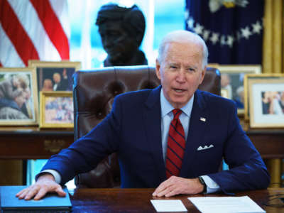 President Joe Biden speaks before signing executive orders on health care in the Oval Office of the White House in Washington, D.C., on January 28, 2021.