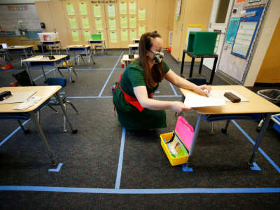 Alta Vista Elementary School kindergarten teacher Bridget Vorland prepares the classroom before students arrive as Redondo Beach Unified School district has welcomed back some of its K-2 students this week through a waiver. Alta Vista Elementary School on Tuesday, Feb. 2, 2021 in Redondo Beach, CA.