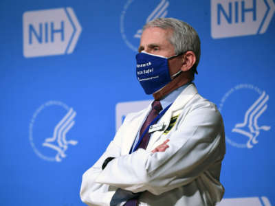 White House Chief Medical Adviser on COVID-19 Dr. Anthony Fauci listens to President Biden (out of frame) speak during a visit to the National Institutes of Health in Bethesda, Maryland, February 11, 2021.