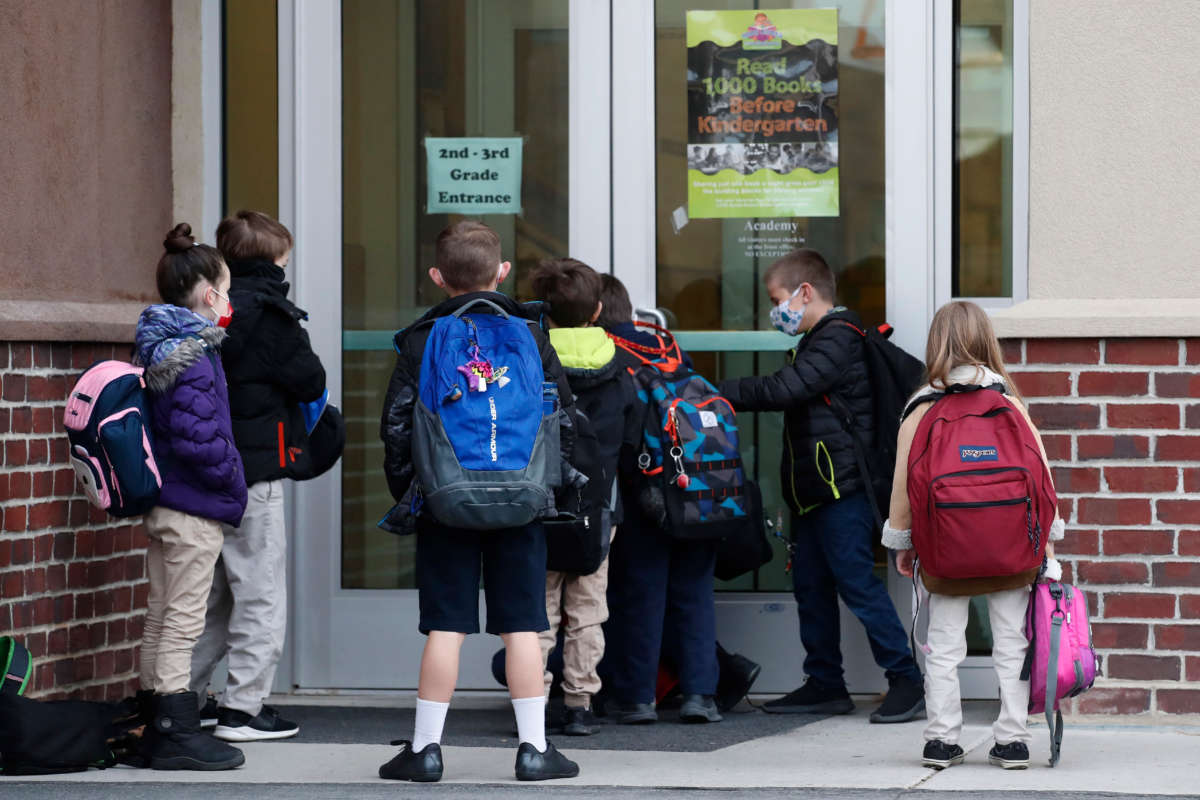 Students wait to enter the school at Freedom Preparatory Academy on February 10, 2021, in Provo, Utah.